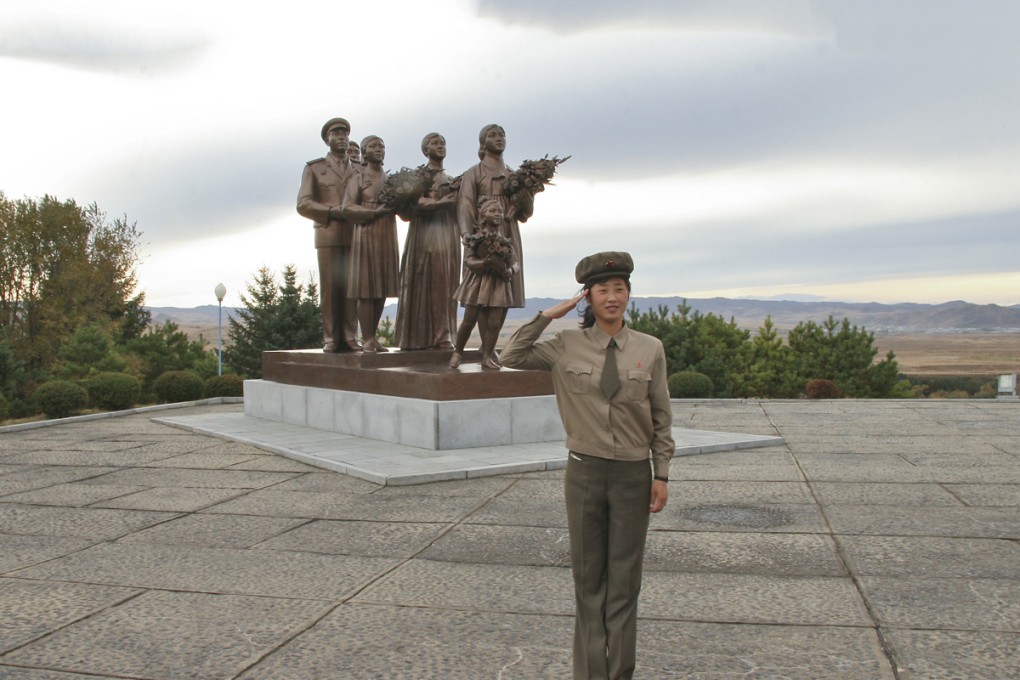 A North Korean guide at the Wangjaesan Grand Monument, outside the town of Onsong, on the northeast border with China.