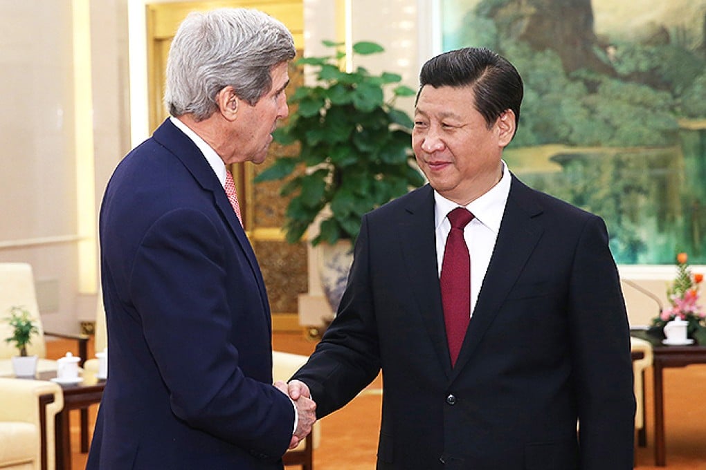 US Secretary of State John Kerry greets President Xi Jinping yesterday at the Great Hall of the People in Beijing. Photo: AP