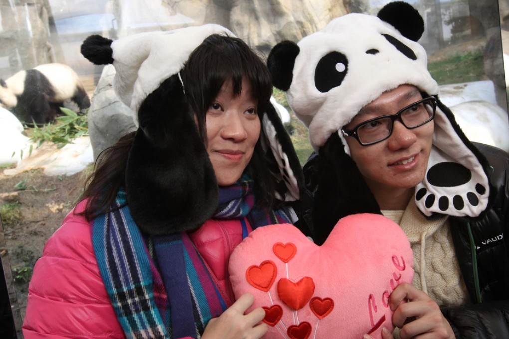 Grace Chan and James Ng were among the singles hoping to find some animal attraction at Ocean Park's panda enclosure. Photo: Dickson Lee