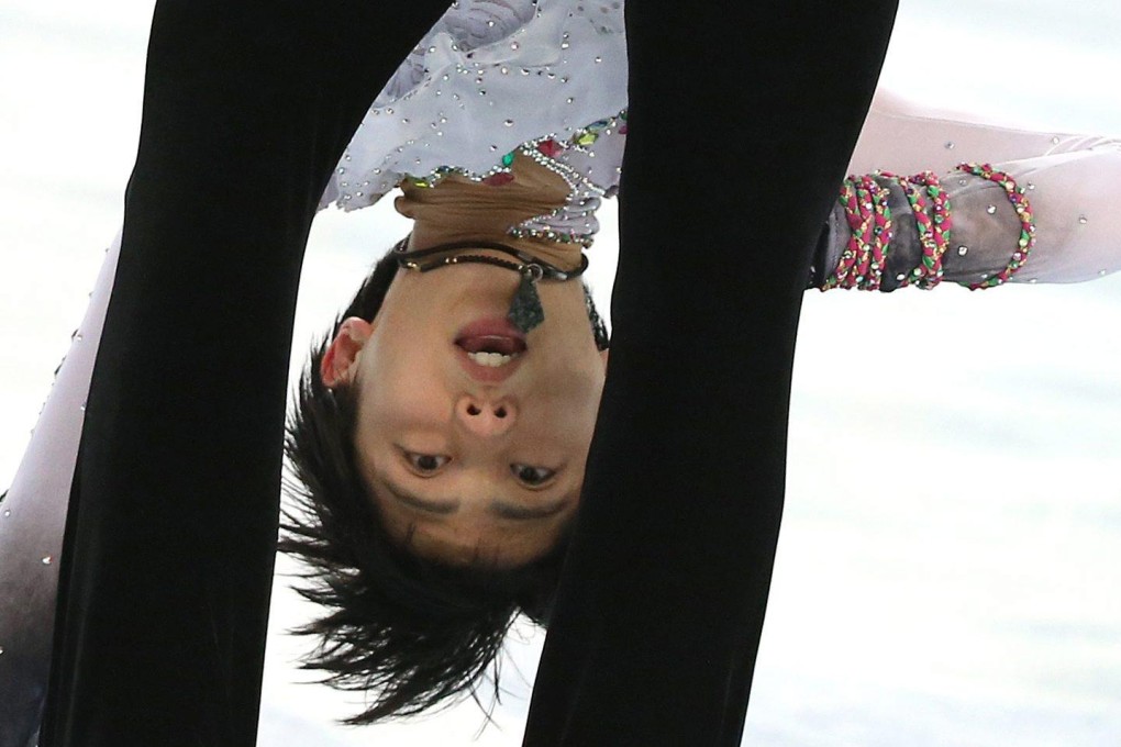 Yuzuru Hanyu performs his routine; celebrating with the national flag; some of his growing legion of fans back in Japan read all about his exploits. Photos: EPA, AFP
