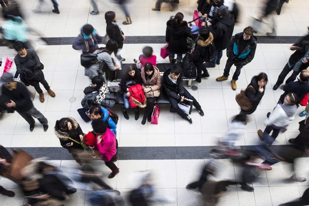 Shoppers make their way through the Eaton Centre in Toronto. Photo: AP