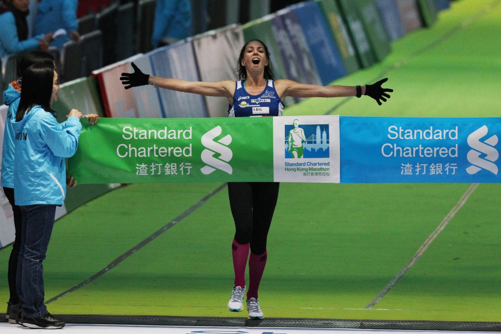 Jane Richards crosses the finish line at Victoria Park to win the women's Half Marathon. Photo: Nora Tam