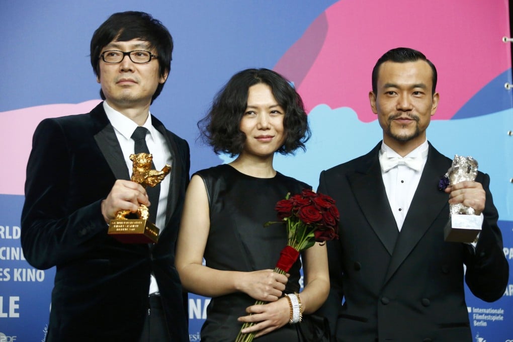 Actor Liao Fan director Diao Yinan and producer Qu pose with Silver Bear for Best Actor and Golden Bear for Best film after awards ceremony of 64th Berlinale International Film Festival in Berlin. Photo: Reuters