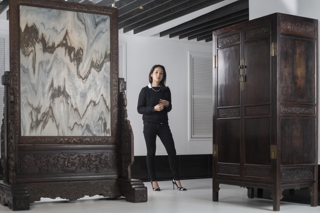 Lynn Fung with two of the pieces on display at the Liangyi Museum.Photo: Antony Dickson