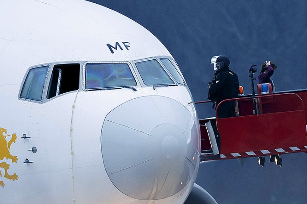 Police stand by after passengers were evacuated from a hijacked Ethiopian Airlines plane. Photo: AP