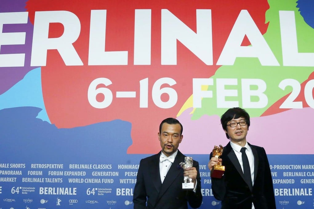 Golden Bear winner Liao Fan (left) and Diao Yinan, director of Black Coal, Thin Ice, celebrate their wins. Photo: Reuters