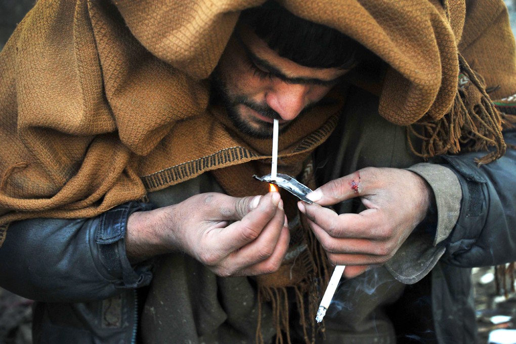 A drug addict smokes heroin. Norway has western Europe's worst overdose rate. Photo: AFP