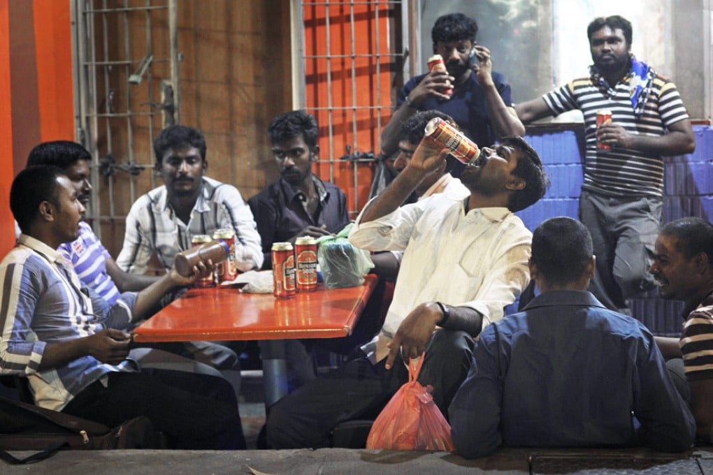Migrant workers in Singapore's Little India District. A row is brewing over the activity of repatriation companies. Photo: AP