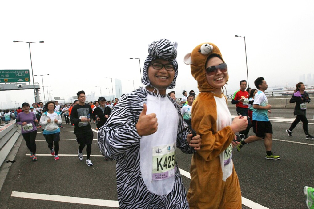 Runners Udo Wong Chun-hin and Cherry Chiu Cheuk-ying wearing 'onesy' animal outfits. Photo: Felix Wong