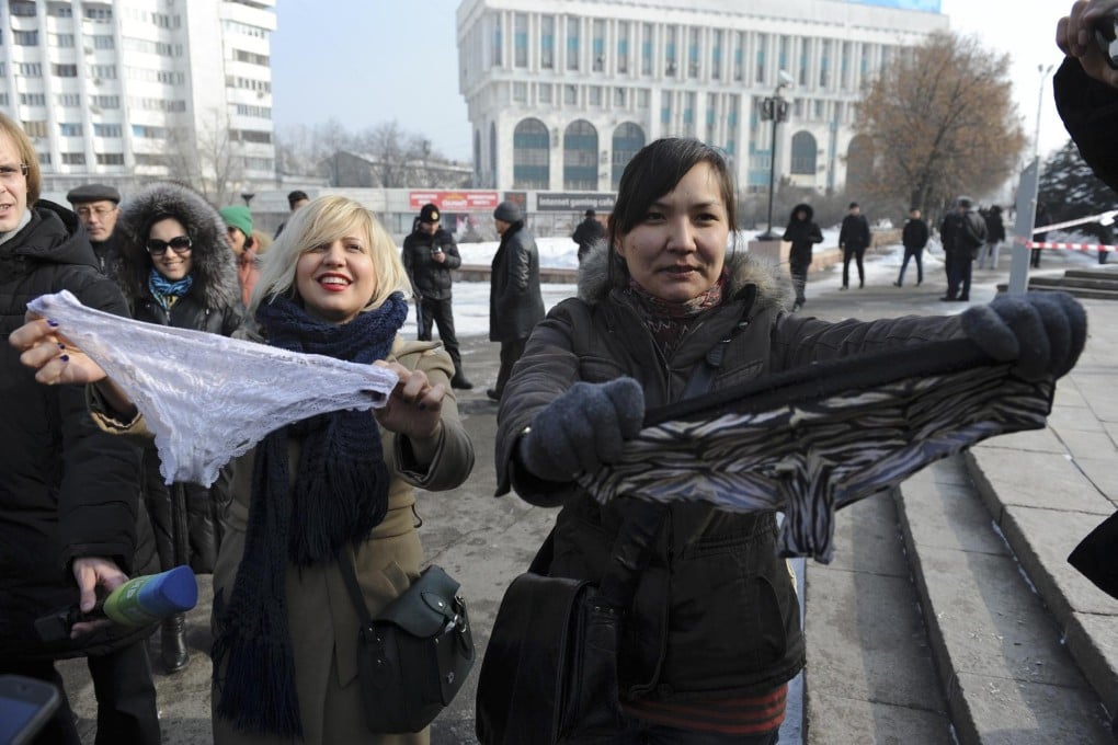 Two women protest against the ban in Almaty, Kazakhstan. Photo: AP