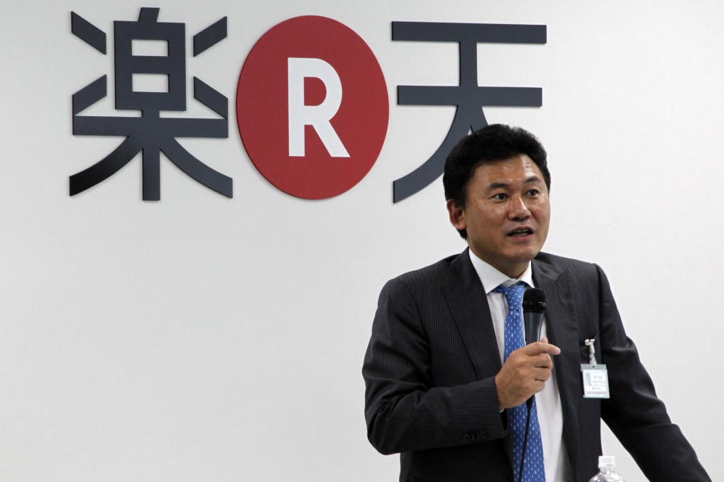 Hiroshi Mikitani speaks to staff at Rakuten headquarters. Photo: AP