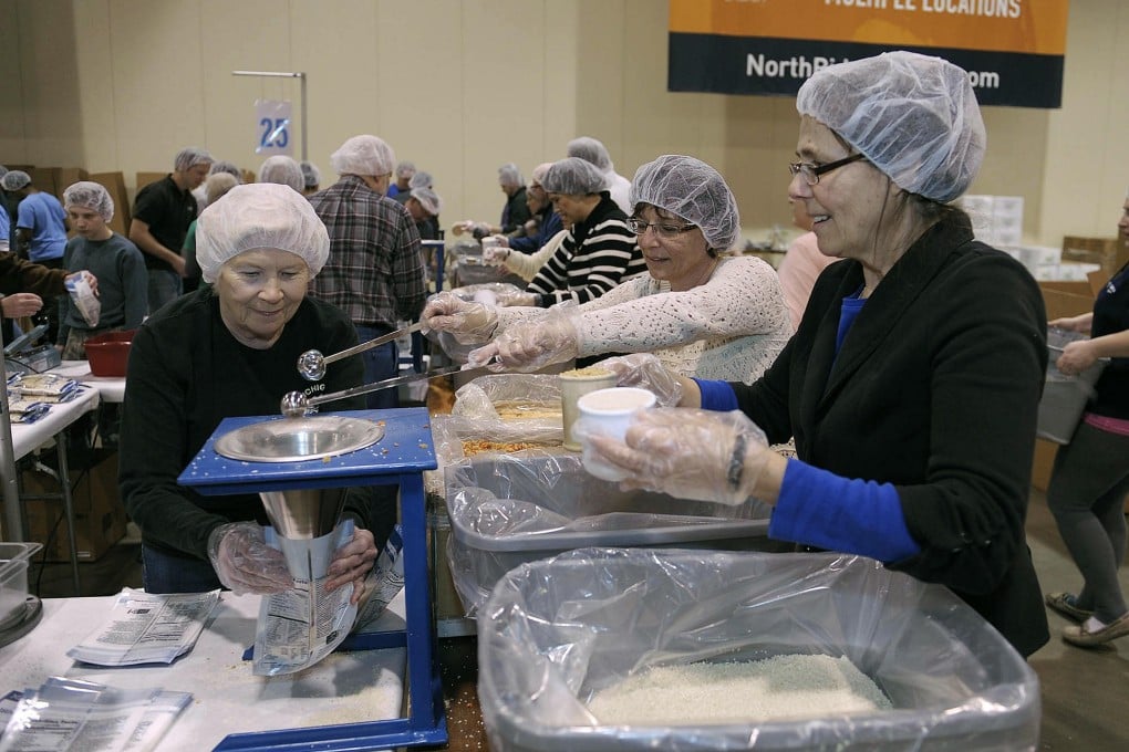 Thousands of volunteers put together two million meals to be shipped to El Salvador, Haiti and the Philippines. Photo: AP