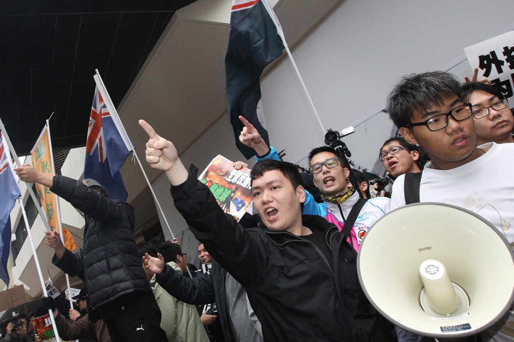 Protesters march from the Star Ferry in Tsim Sha Tsui to Canton Road demanding that the government limit the number of mainland visitors to the territory.