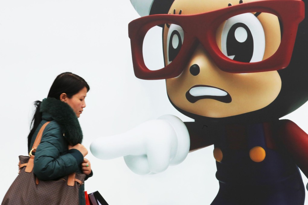 A woman wraps up warm against Hong Kong's cold temperatures, which were lower last week than in Sochi, Russia. Photo: David Wong