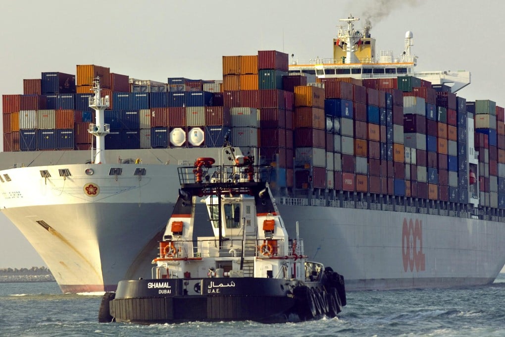 A tug boat receives a container ship in Dubai. Private equity funds may end up taking over shipping lines that default. Photo: Bloomberg