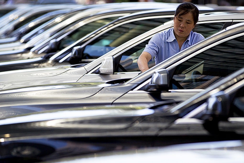 Second hand BMWs on display at a Beijing mall. Photo: AP