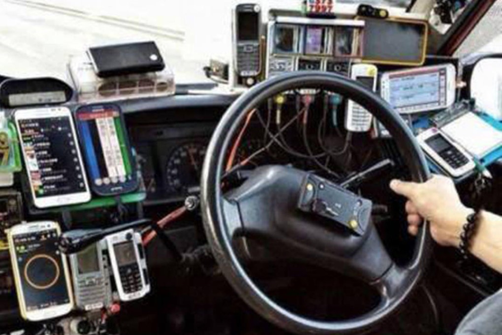 Taxi dashboards often feature multiple smartphones.