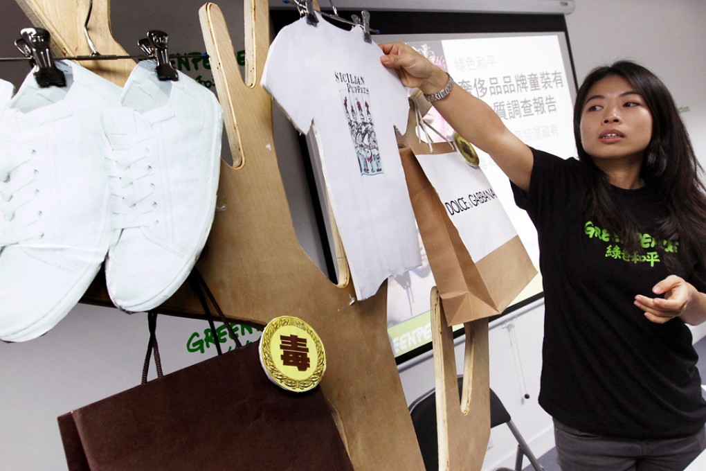 Greenpeace activist Kate Lin reveals the results of the environmental group's tests on designer children's wear. Photo: Dickson Lee