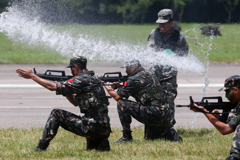 PLA soldiers perform fighting techniques. Photo: SCMP