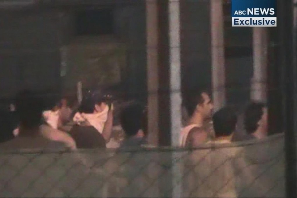 An image from an Australian Broadcasting Corporation video of clashes at the Manus Island detention centre on Sunday. Photo: Reuters