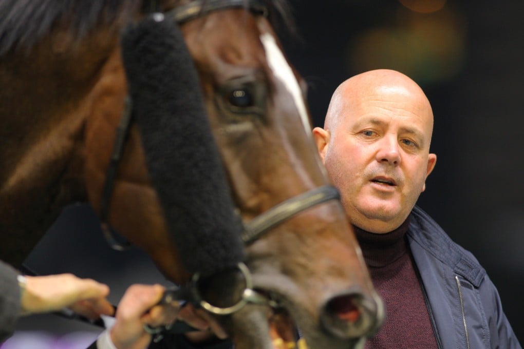 Sean Woods, pictured here with recent Class Five winner Highland Dragon, was fined HK$3,000 for the "improper act" of slapping Wire To Wire before the start of the Classic Cup on Sunday. Photo: Kenneth Chan