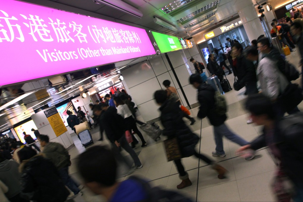 Travellers crossing from Hong Kong to Shenzhen at the Lo Wu border checkpoint. Photo: Felix Wong