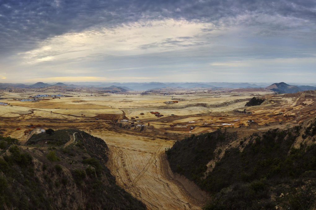 A shot of Yan'an by He Xingyou shows how mountains have been flattened to make way for a new town.