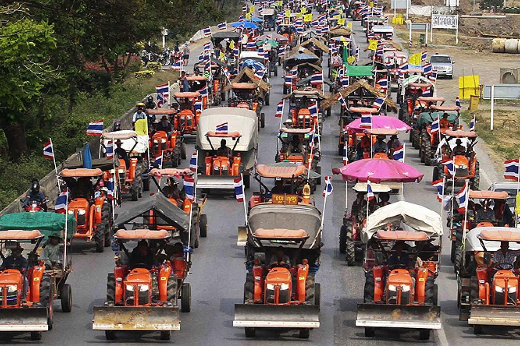 Farmers drive their tractors and other farm vehicles towards Bangkok. Photo: Reuters