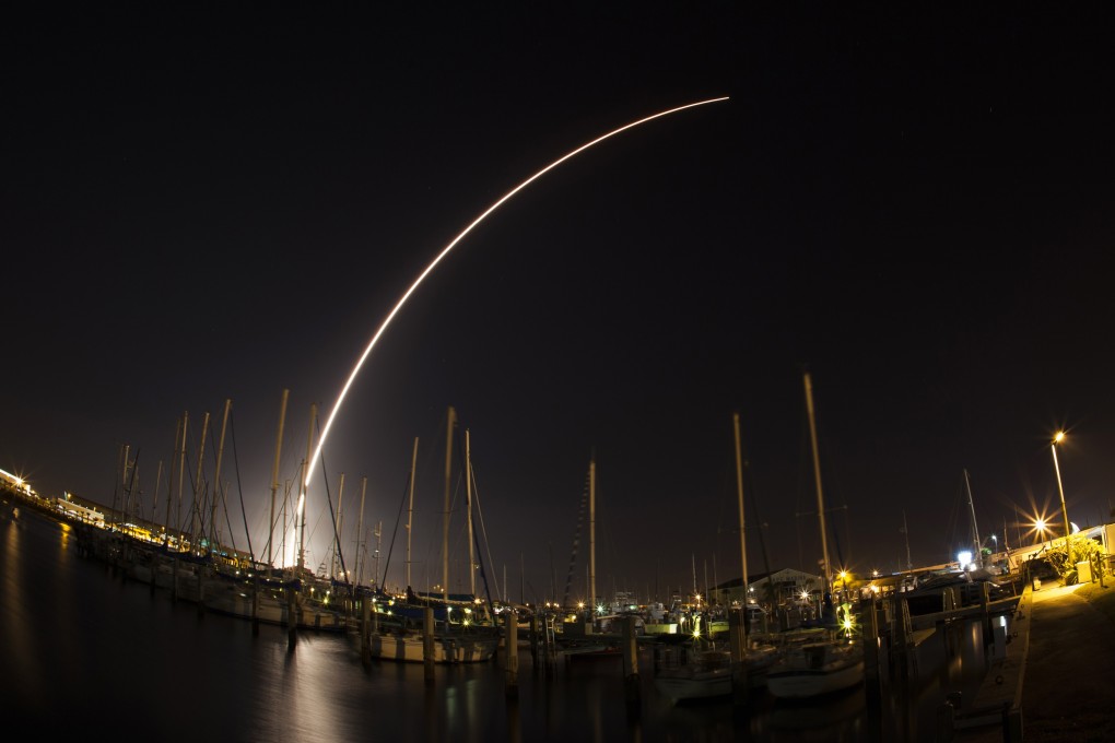 the Delta IV rocket carrying the satellite into orbit streaks across the sky after launching from Cape Canaveral Air Force Station in Florida on Thursday. Photo: Reuters
