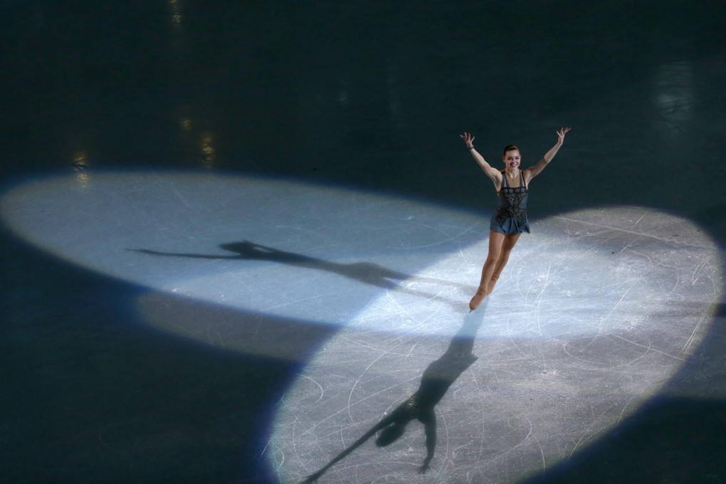 Gold medallist Adelina Sotnikova of Russia celebrates and acknowledges the crowd after the women's figure skating event. Photo: EPA