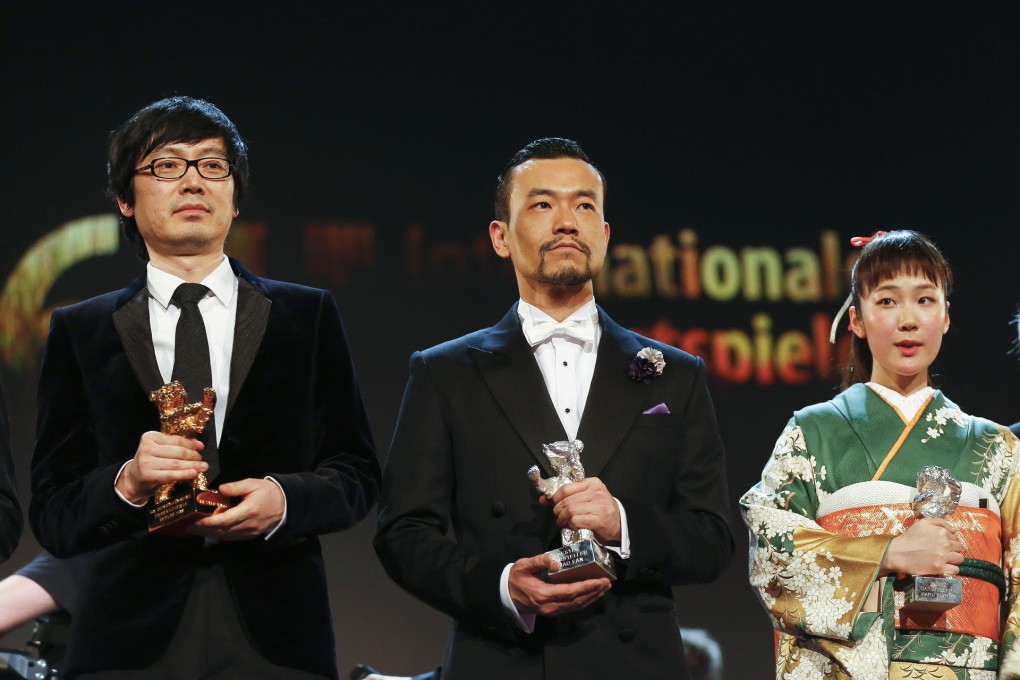 Best actress Haru Kuroki (right) shares the spotlight with fellow winners, director Diao Yinan (left) and his Black Coal, Thin Ices tar Liao Fan. Photo: AP