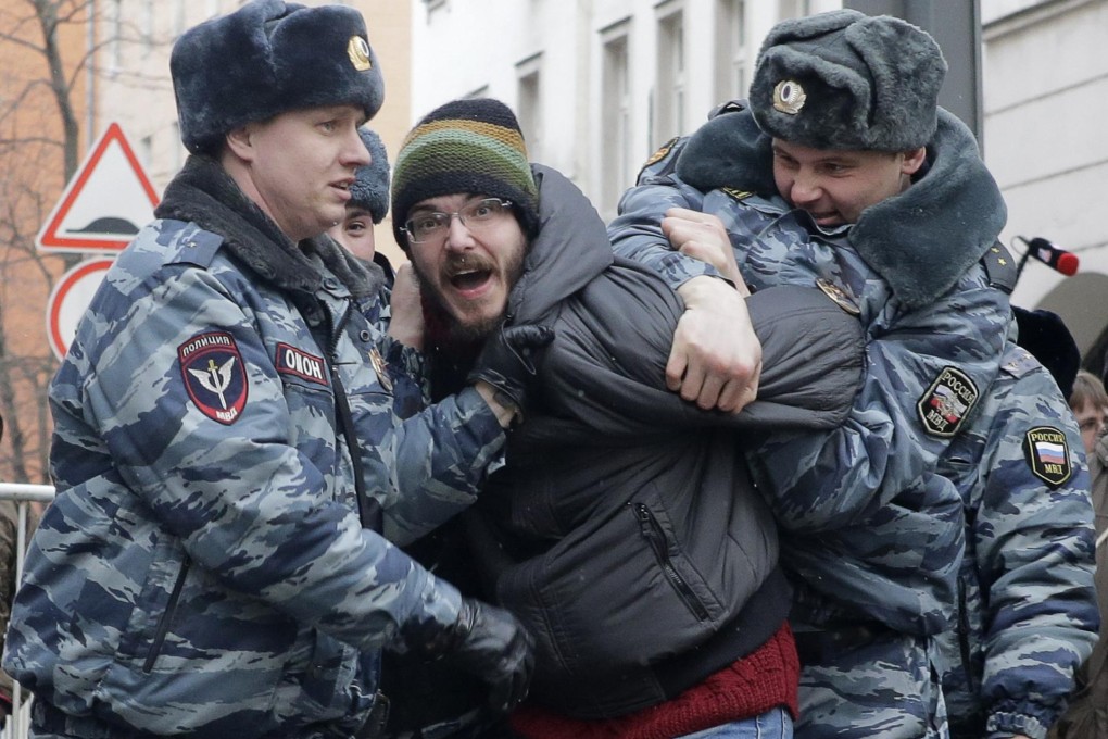 A protester is arrested outside the courthouse. Photo: Reuters