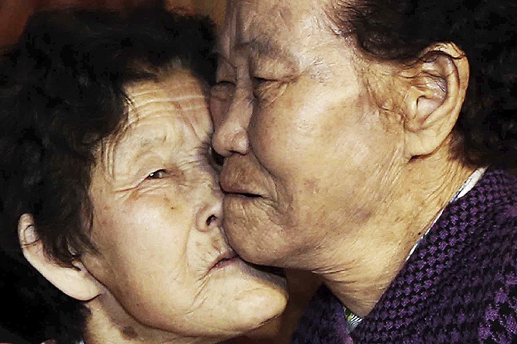 South Korean Lee Chun-hwa, 84, (right), gets a kiss from her North Korean sister Lee Chun-son at a family reunion in the North Korean Diamond Mountain resort on Saturday. Photo: AP
