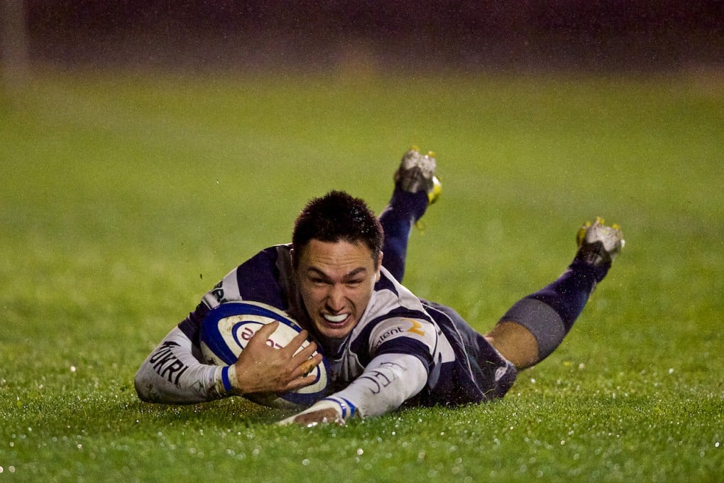 Adam Raby, shown here touching down for Newedge Club, scored a try and added two conversions to help the Hong Kong Dragons reach the Plate final in Perth. Photo: HKRFU