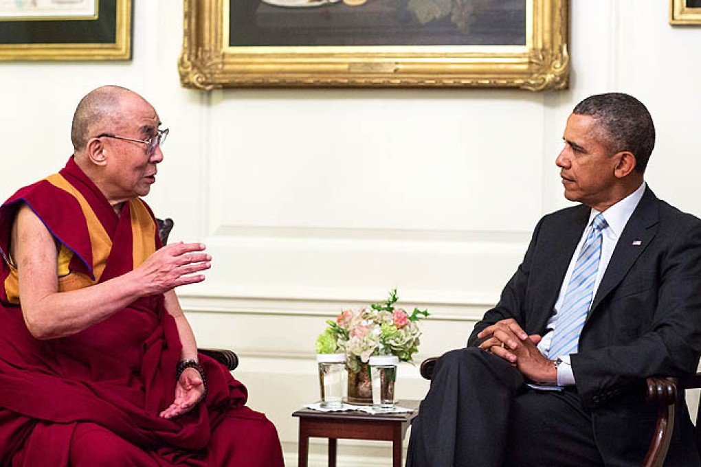 US President Barack Obama with the Dalai Lama in the Map Room of the White House in Washington on Friday. Photo: EPA