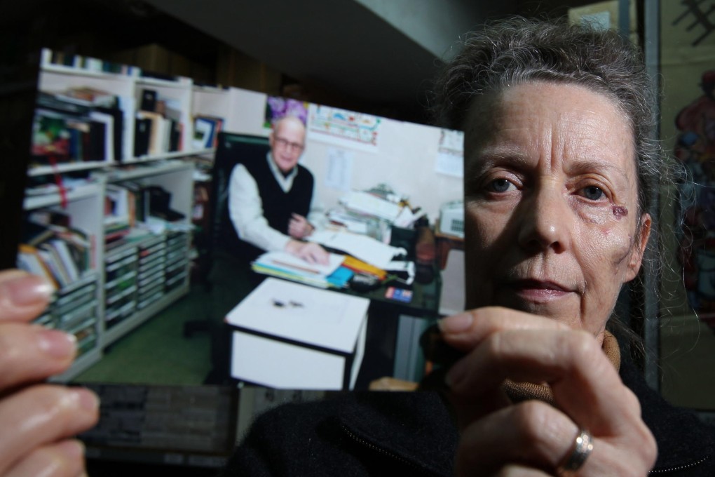 Karen Short shows a photo of husband, John. Photo: Nora Tam