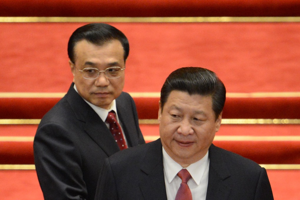 Li Keqiang, then Chinese vice premier, walks past President Xi Jinping during the 12th National People's Congress in Beijing on March 14, 2013. Photo: AFP