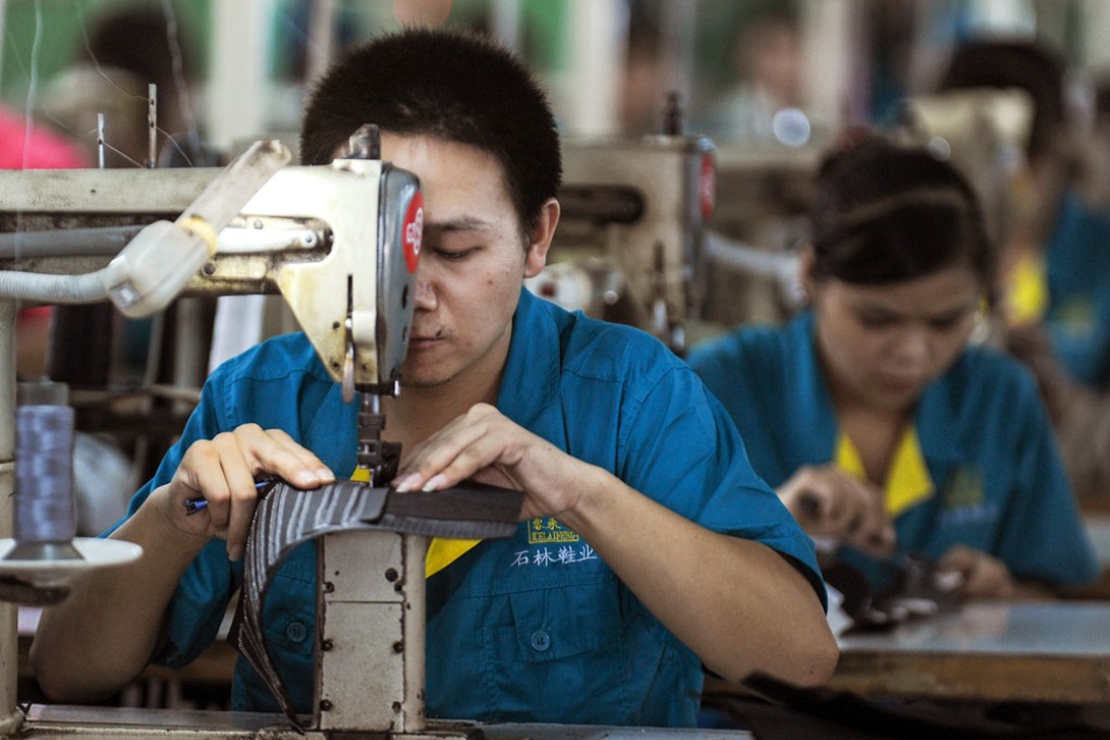 A worker in a shoe factory in Wenling city. An extensive crackdown on workplace safety standards has forced the closure of more than 4,500 shoe factories. Photo: Xinhua