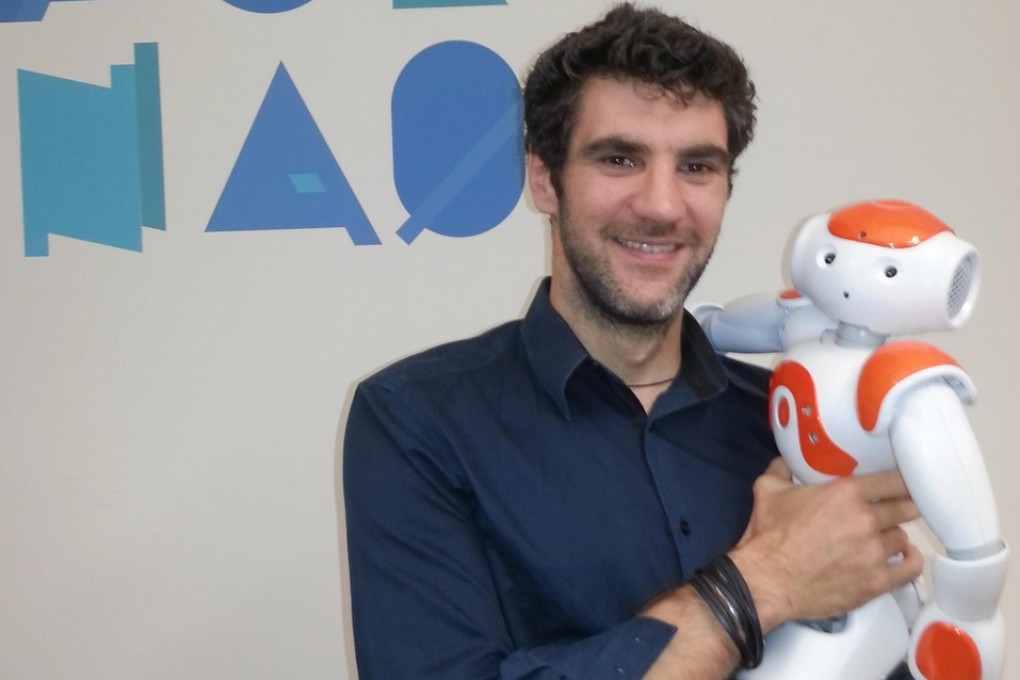 Dr Olivier Joubert with the NAO robot.