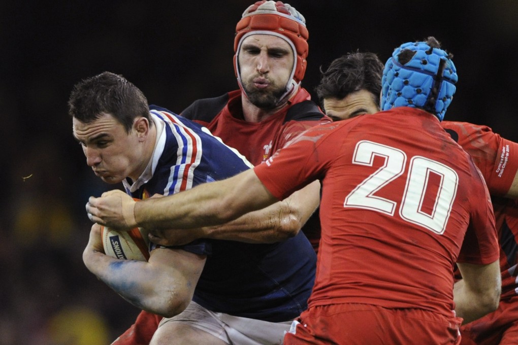 Louis Picamoles (left) in action for France in their match against Wales. The number eight appeared to mockingly applaud referee Alain Rolland after he was shown a yellow card. Photo: Reuters
