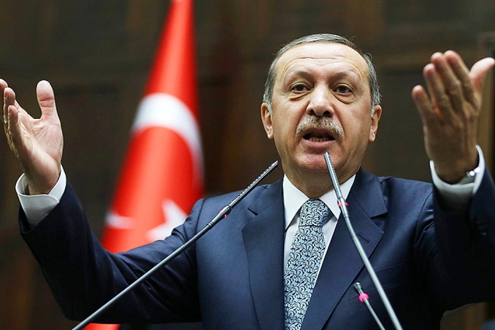 Turkey's Prime Minister Recep Tayyip Erdogan addresses members of his ruling AK Party during a session at the Turkish parliament in Ankara on Tuesday. Photo: AFP