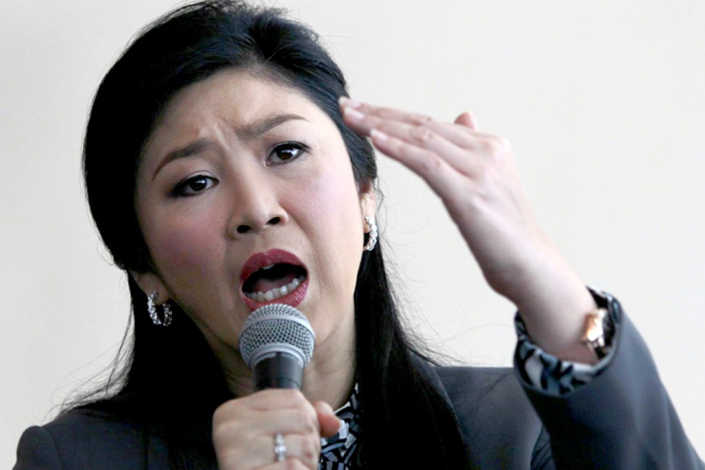 Embattled Thai PM Yingluck calls for talks after fleeing Bangkok