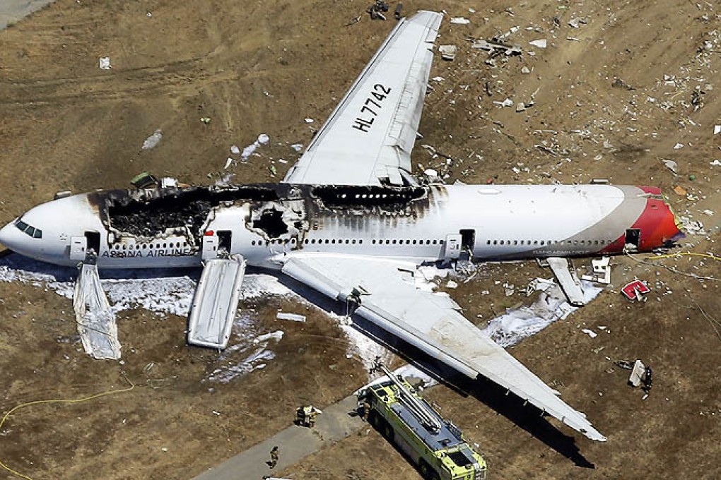 The wreckage of Asiana Flight 214 lies on the ground after it crashed at the San Francisco International Airport in San Francisco on July 6, 2013. Photo: AP