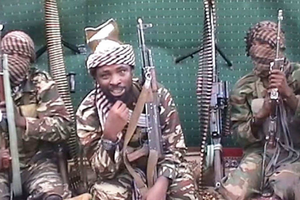 Nigerian Islamist extremist group Boko Haram leader Abubakar Shekau (centre). Photo: AFP