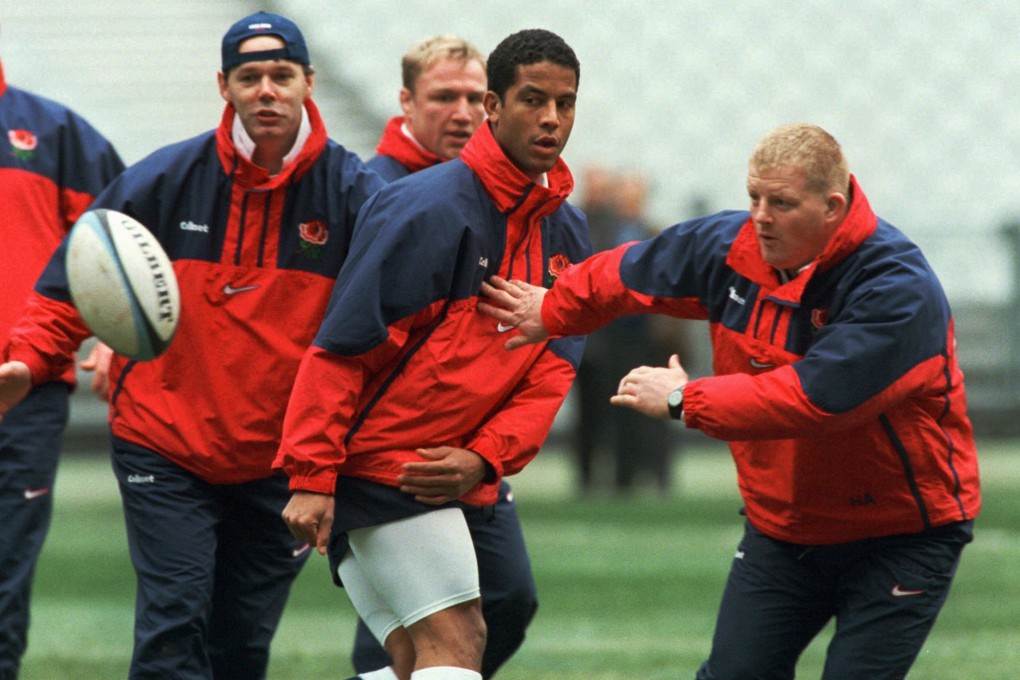 Jeremy Guscott (centre) with the England side in 1998. The squad was then coached by Clive Woodward (left). Photo: Reuters