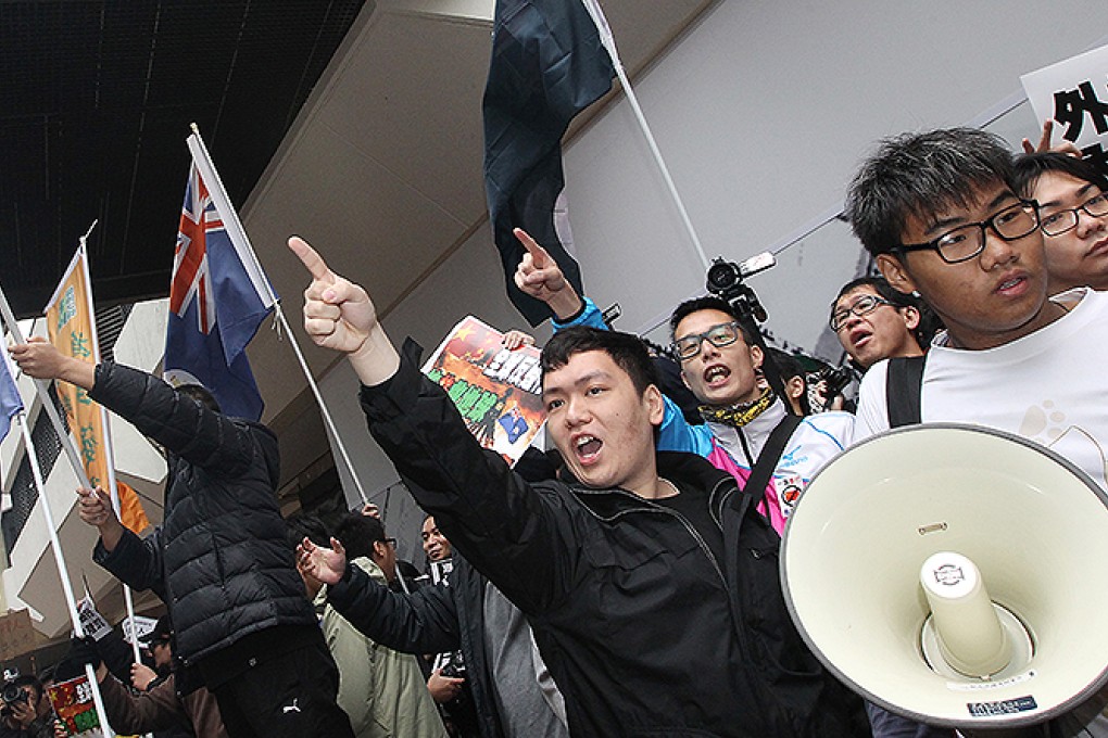Protesters shout anti-mainlander slogans at the star Ferry in Tsim Sha Tsui. Photo: Felix Wong