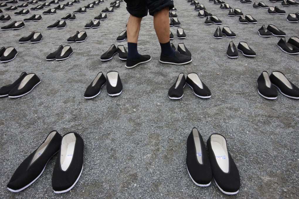 A 2009 memorial places 6,830 pairs of cloth shoes in a park, in memory of the dead Chinese forced labourers in Japan. Photo: Xinhua