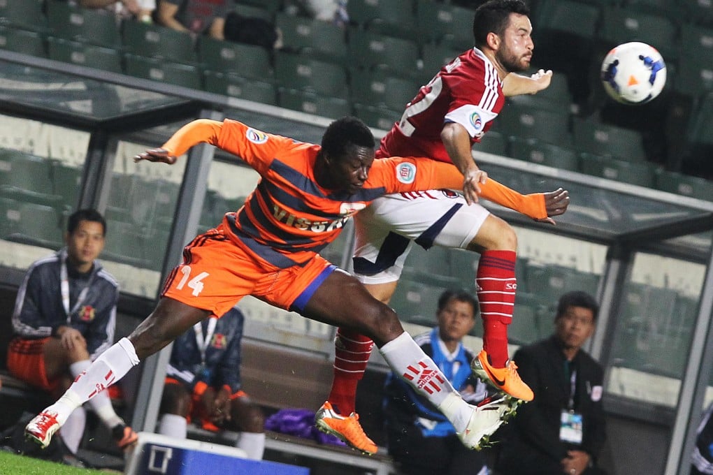 Patiyo Tambwe of Vissai Ninh Binh and Jack Sealy battle for possession in their AFC Cup match at Hong Kong Stadium. Photo: Sam Tsang