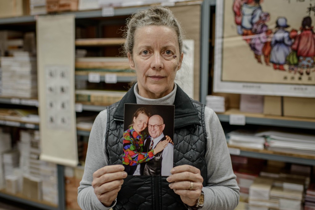 Karen Short holds a picture of herself and her husband Australian missionary John Short, who is currently detained in North Korea. Photo: AFP