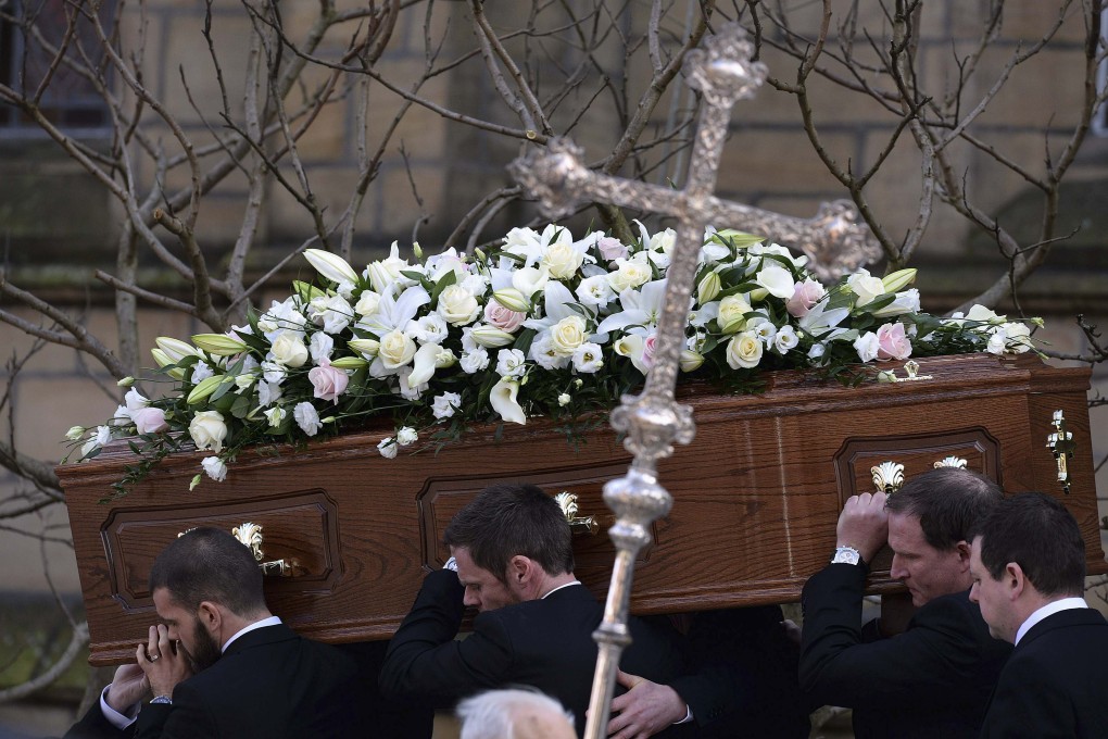 Pall-bearers carry the coffin of former Preston and England soccer player Tom Finney after his funeral in Preston on Friday. Photo: Reuters